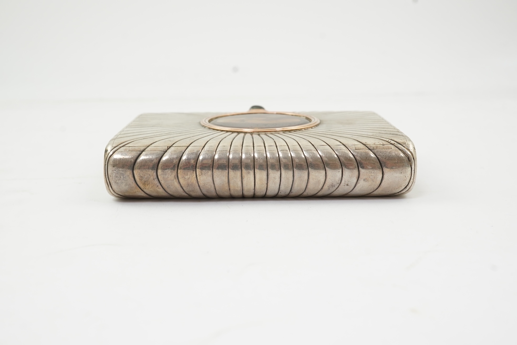An early 20th century Russian 84 zolotnik silver cigarette case, with cappuccino agate inset cover, of ribbed rectangular form